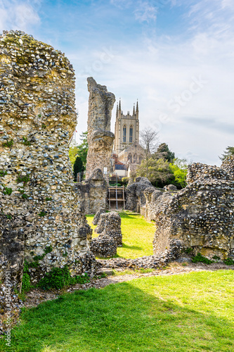 A view past the Abbey ruins and towards the cathedral at Bury Saint Edmunds on a bright day in springtime