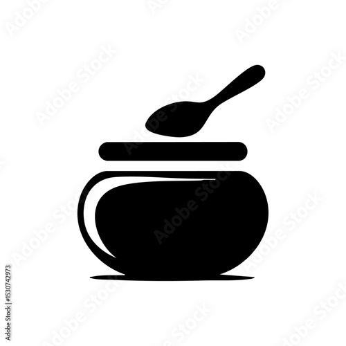Black vector icon of a body scrub container with spoon, representing skincare or beauty treatment.

