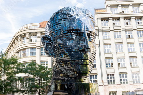 A kinetic sculpture of Franz Kafka’s head in Prague, made of rotating reflective layers that form and dissolve the face in a hypnotic motion