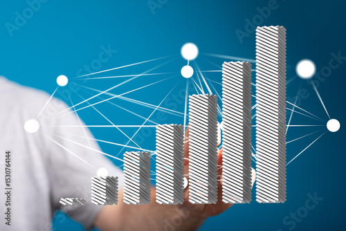 Stock photo of a hand interacting with a 3D bar graph illustrating growth and networking.