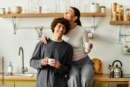 Joyful moments shared in a cozy kitchen while sipping warm drinks together
