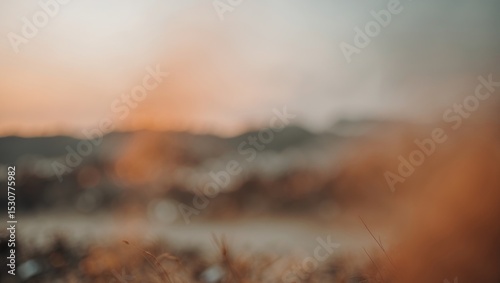 Blurred background of an industrial wall featuring rusty metal sheets and a weathered concrete base at a construction site. Out-of-focus image suitable for use as a background. photo