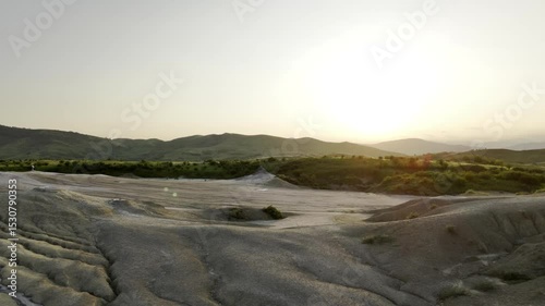 Buzău's Boiling Mud Volcanoes.
This aerial video captures a surreal landscape in Buzău County, Romania, showcasing the unique and otherworldly Muddy Volcanoes. 