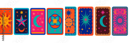Colorful tarot cards featuring celestial symbols and designs during a spiritual reading session