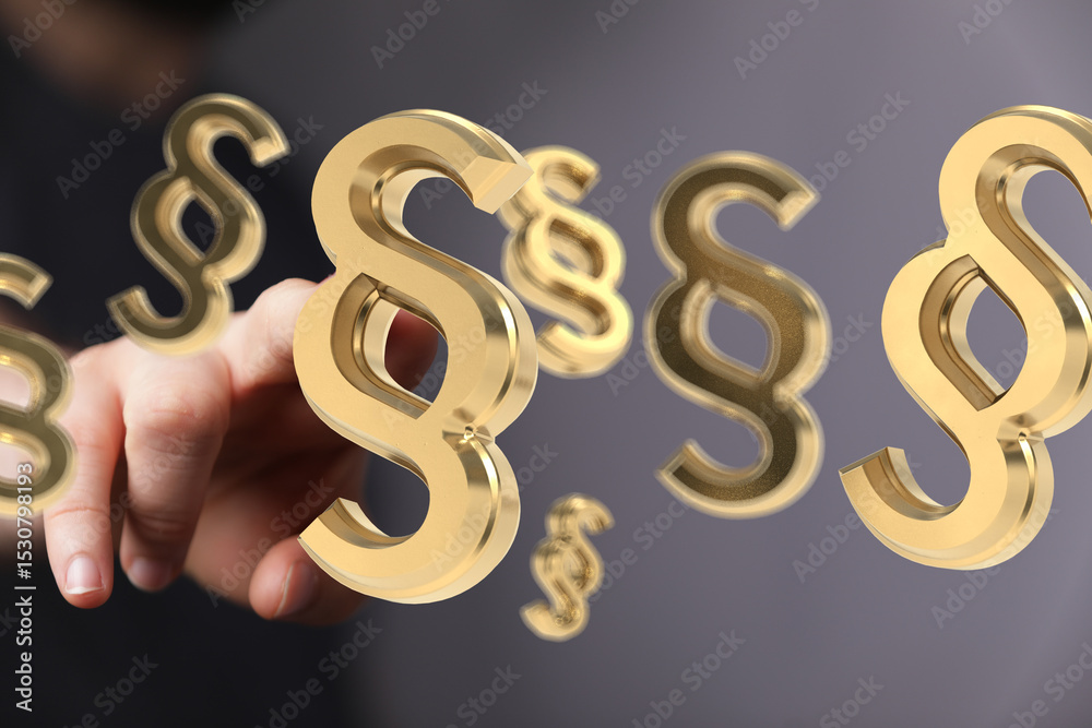 Hand interacting with 3D golden paragraph symbols. Legal, law, justice concept. Hand interacting with 3D golden paragraph symbols. Legal, law, justice concept.