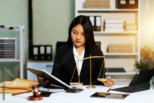 Judge gavel with Justice lawyers having team meeting at law firm background. Concepts of Law and Legal services.