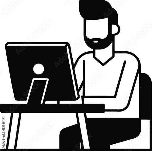 A bearded man working on Silhouette a computer at a desk drawing