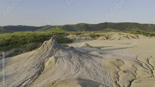 Buzău's Boiling Mud Volcanoes.
This aerial video captures a surreal landscape in Buzău County, Romania, showcasing the unique and otherworldly Muddy Volcanoes. 