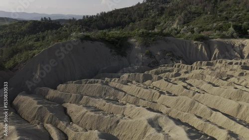 Buzău's Boiling Mud Volcanoes.
This aerial video captures a surreal landscape in Buzău County, Romania, showcasing the unique and otherworldly Muddy Volcanoes. 
