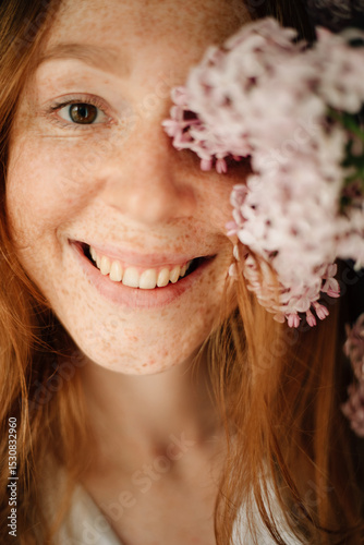 Redhead girl with freckles smiling