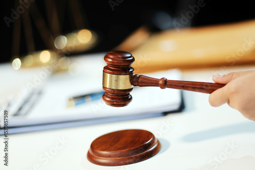 Judge gavel with Justice lawyers having team meeting at law firm background. Concepts of Law and Legal services.