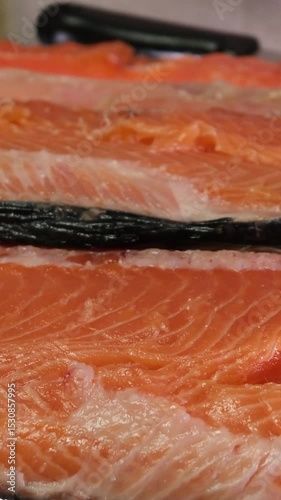 fillet salmon. fillet salmon is cut into slices and stacked. The concept of freshness and abundance as salmon is a healthy and nutritious food source.