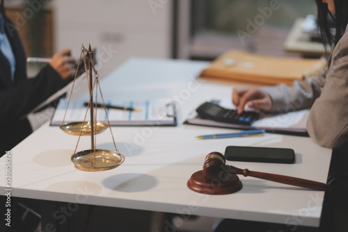 Consultation and conference of lawyers and professional businessman working and discussion having at law firm in office. Concepts of law, Judge gavel with scales of justice.