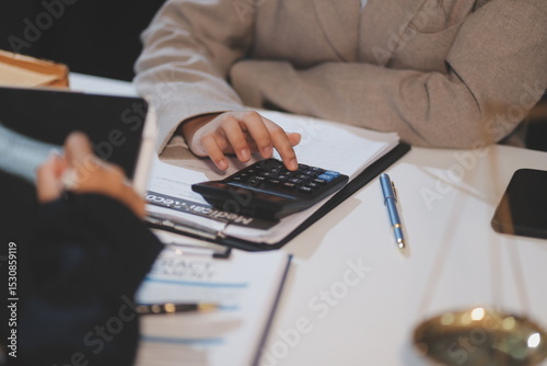 Consultation and conference of lawyers and professional businessman working and discussion having at law firm in office. Concepts of law, Judge gavel with scales of justice.