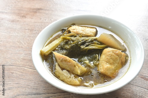 boiled braised mixed vegetable with tofu in Chinese herb stew soup on bowl 