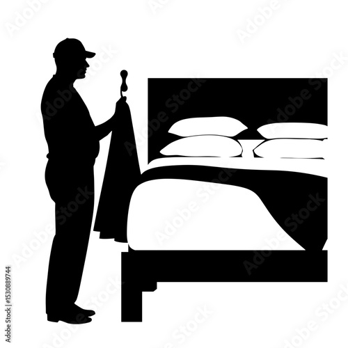Silhouette of person hanging robe on wall hook beside bed, modern simplicity