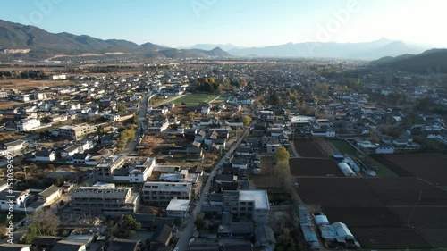 Soar above Baisha Ancient Town and witness its timeless beauty from the sky. Traditional rooftops stretch across the valley. Mountains embrace the horizon. A hidden gem waiting to be explored by curio
