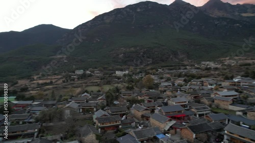 Soar above Baisha Ancient Town and witness its timeless beauty from the sky. Traditional rooftops stretch across the valley. Mountains embrace the horizon. A hidden gem waiting to be explored by curio