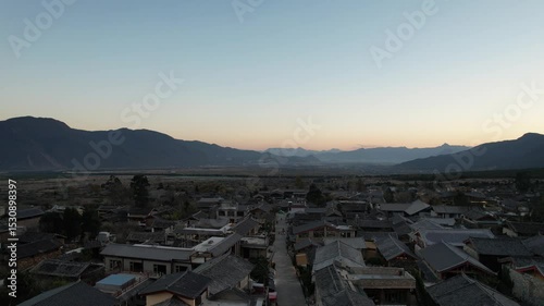 Soar above Baisha Ancient Town and witness its timeless beauty from the sky. Traditional rooftops stretch across the valley. Mountains embrace the horizon. A hidden gem waiting to be explored by curio