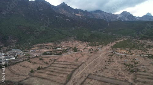 Soar above Baisha Ancient Town and witness its timeless beauty from the sky. Traditional rooftops stretch across the valley. Mountains embrace the horizon. A hidden gem waiting to be explored by curio