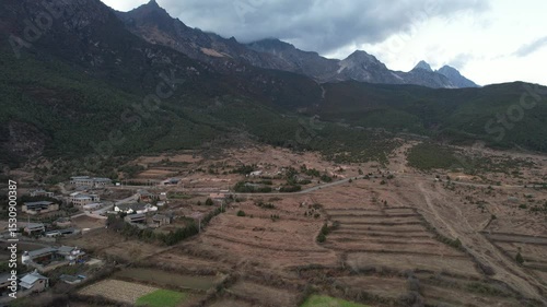 Soar above Baisha Ancient Town and witness its timeless beauty from the sky. Traditional rooftops stretch across the valley. Mountains embrace the horizon. A hidden gem waiting to be explored by curio
