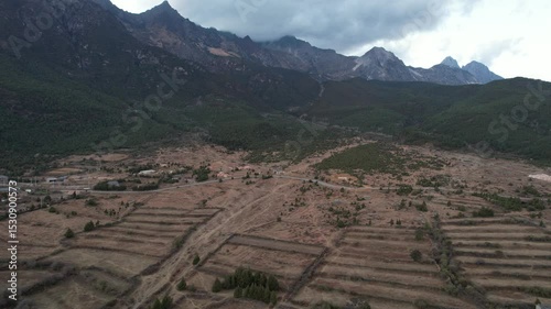 Soar above Baisha Ancient Town and witness its timeless beauty from the sky. Traditional rooftops stretch across the valley. Mountains embrace the horizon. A hidden gem waiting to be explored by curio
