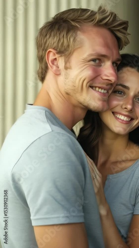 A couple smiles while wearing American flag t-shirts, showcasing their love for the USA and celebrating togetherness in a warm atmosphere