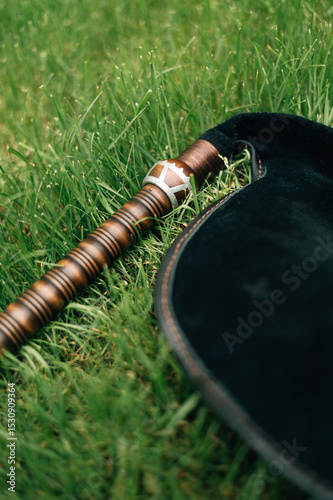 The bagpipe lies on the grass
