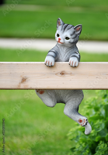 Toy Cat on Fence