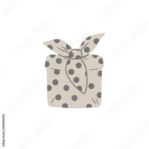 Polka-dotted tan gift with tied ribbon, a unique and festive presentation