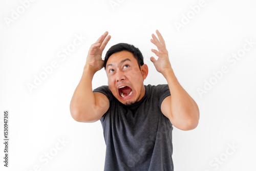 Funny man doing scary face and acting isolated on white background.