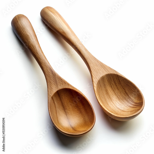 Pair of smooth matte finished wooden serving spoons with long handles photo