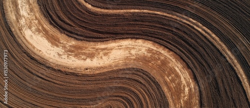 Tilled earth shows distinct patterns in sunlight