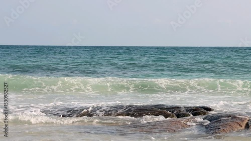 Sea waves crashing against rocks on the shore