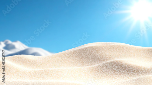 Vast sand dunes under a bright blue sky, capturing the beauty and serenity of a desert landscape bathed in sunlight.