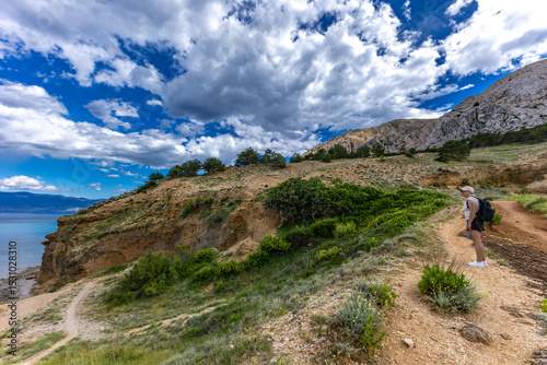 Fototapeta Naklejka Na Ścianę i Meble -  Hiking trail leading from the beach in Baska to the Bag mountain, city panorama seen from above,