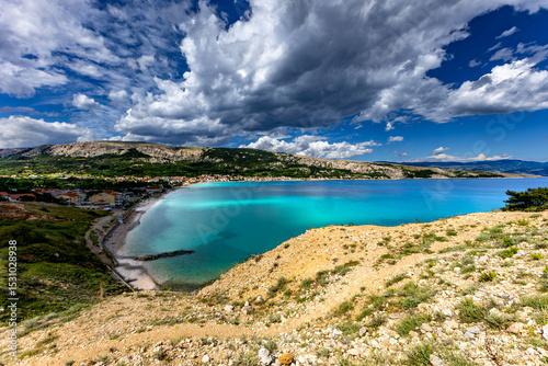 Fototapeta Naklejka Na Ścianę i Meble -  Hiking trail leading from the beach in Baska to the Bag mountain, city panorama seen from above,