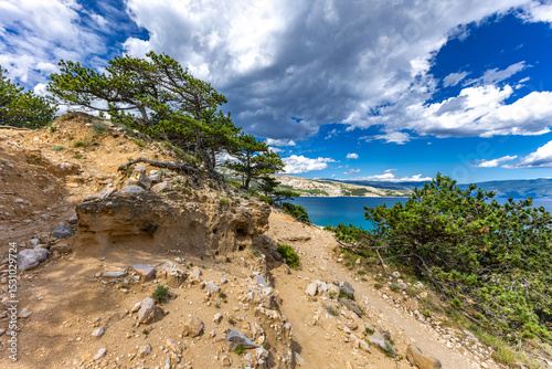 Fototapeta Naklejka Na Ścianę i Meble -  Hiking trail leading from the beach in Baska to the Bag mountain, city panorama seen from above,