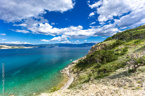 Fototapeta Naklejka Na Ścianę i Meble -  Hiking trail leading from the beach in Baska to the Bag mountain, city panorama seen from above,