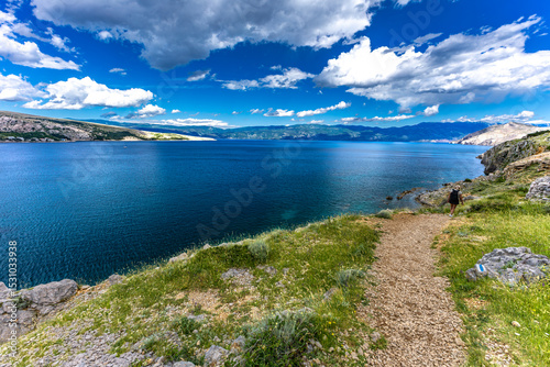 Fototapeta Naklejka Na Ścianę i Meble -  Hiking trail leading from the beach in Baska to the Bag mountain, city panorama seen from above,
