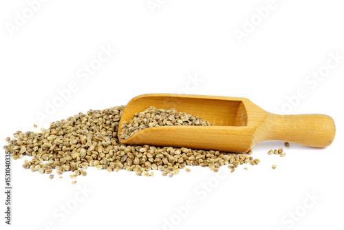 Cannabis seeds pile with wooden scoop isolated on a white background