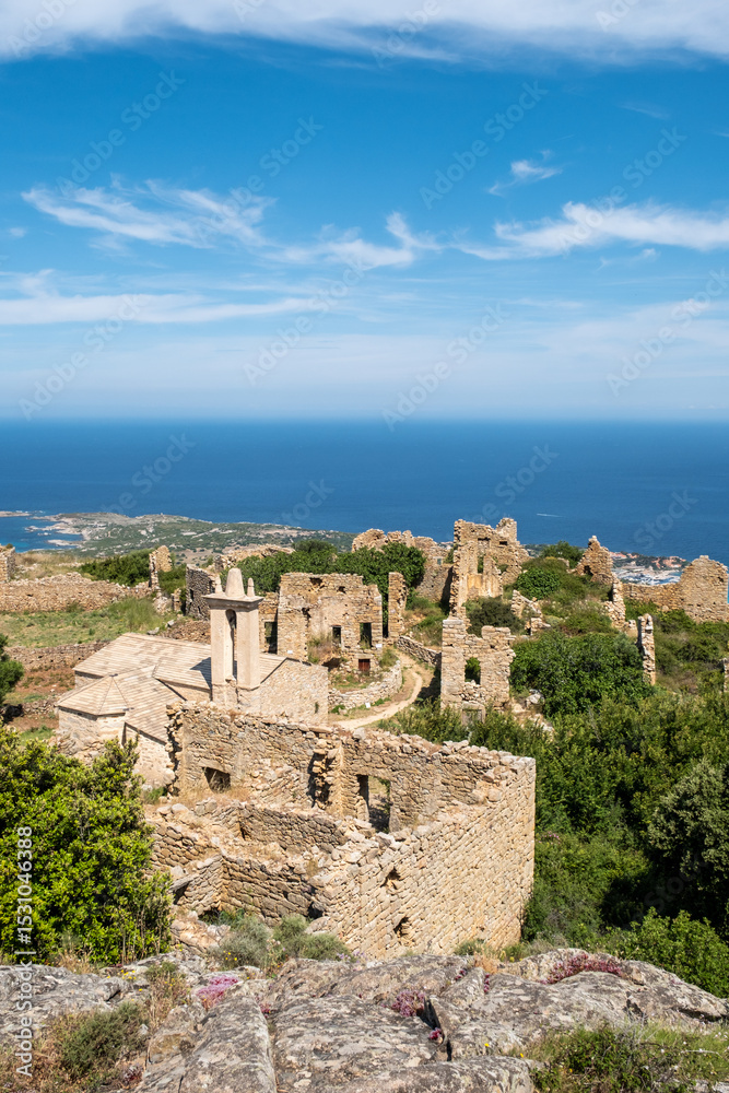 Fototapeta premium Abandoned in the 19th century the ruins of the village of Occi sit above Lumio and look down on the coastline of the Mediterranean island of Corsica. The church was restored in 2002.