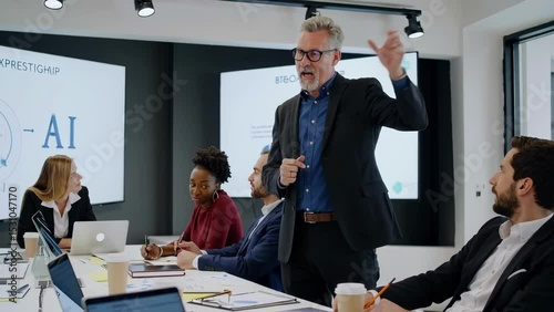 Mature Caucasian Male Leading Business Presentation in Modern Conference Room                        