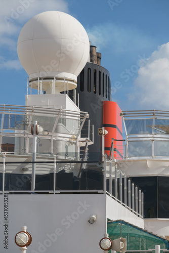 Outdoor promenade boat sun deck onboard modern luxury cruiseship cruise ship ocean liner with teak wood loungers and deck chairs for guests passengers