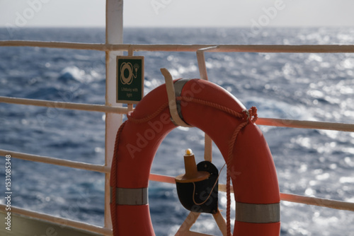 Outdoor promenade boat sun deck onboard modern luxury cruiseship cruise ship ocean liner with teak wood loungers and deck chairs for guests passengers