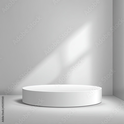White circular podium in a minimalist studio setting, lit by natural light