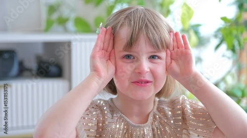 Adorable Cute Smiling Happy Caucasian Preschooler Girl Playing Peek a Boo Covering Eyes with Hands