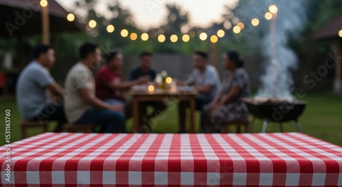 Red Gingham Tablecloth at Blurred Backyard Gathering