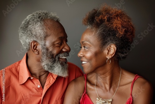 Portrait of a blissful couple in their 40s exchanging glances