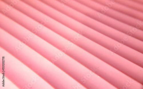 Abstract pink and white striped lines create a colorful textile pattern for a vibrant art backdrop